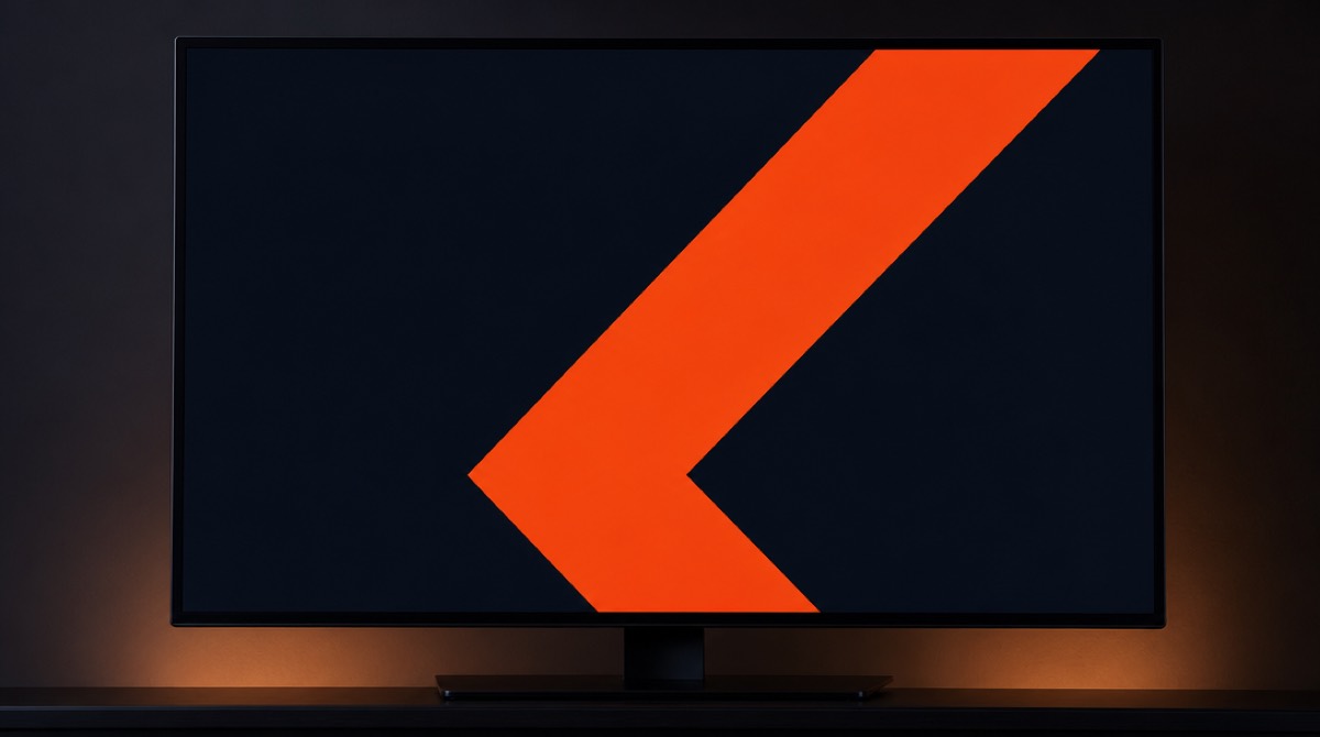 A single polished animated brand frame filling a monitor in a dark room