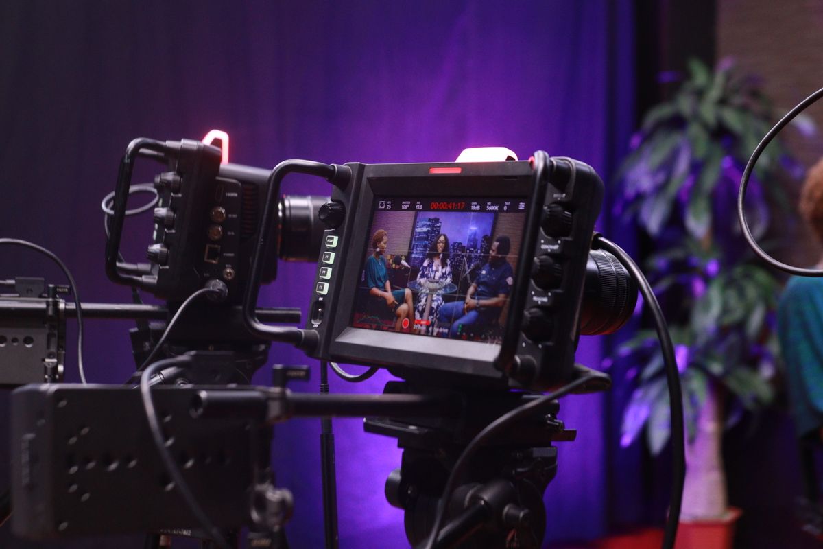 A founder being filmed on camera in a small studio setup