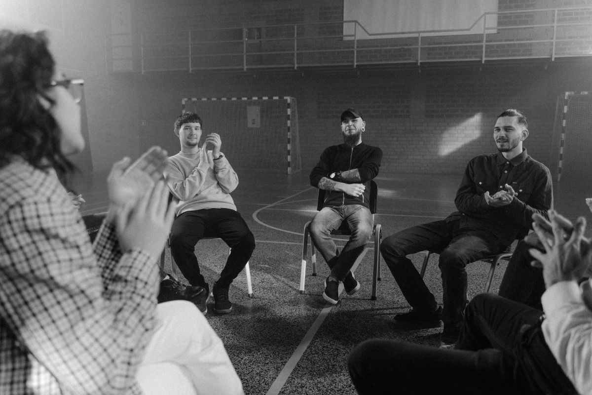 A group in conversation, standing in for an online community
