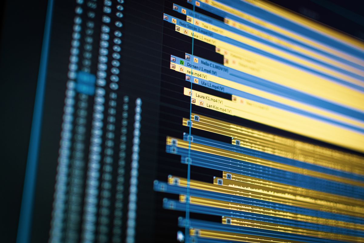 A motion designer working across an animation timeline on screen