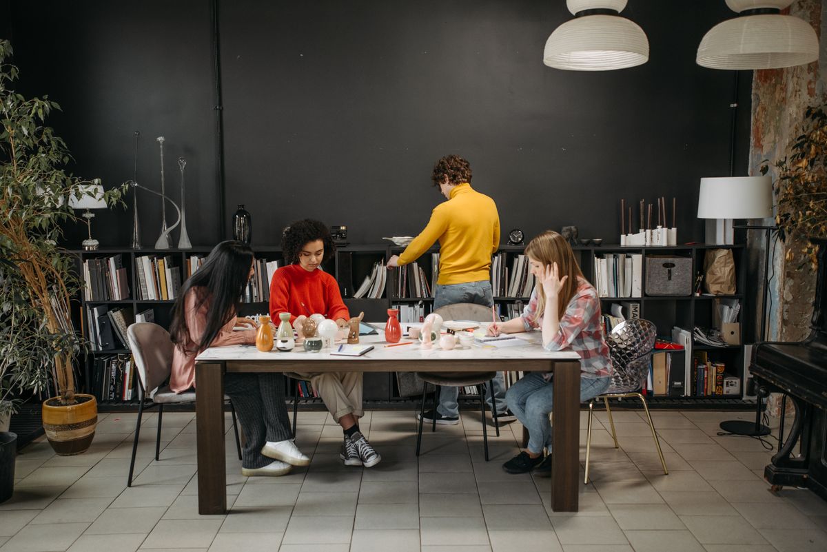 A creative team talking through work together in a studio