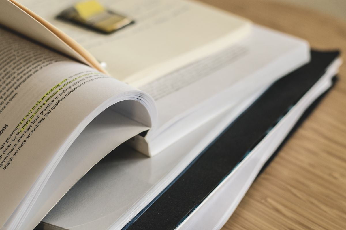 An open reference book showing dense tables and figures